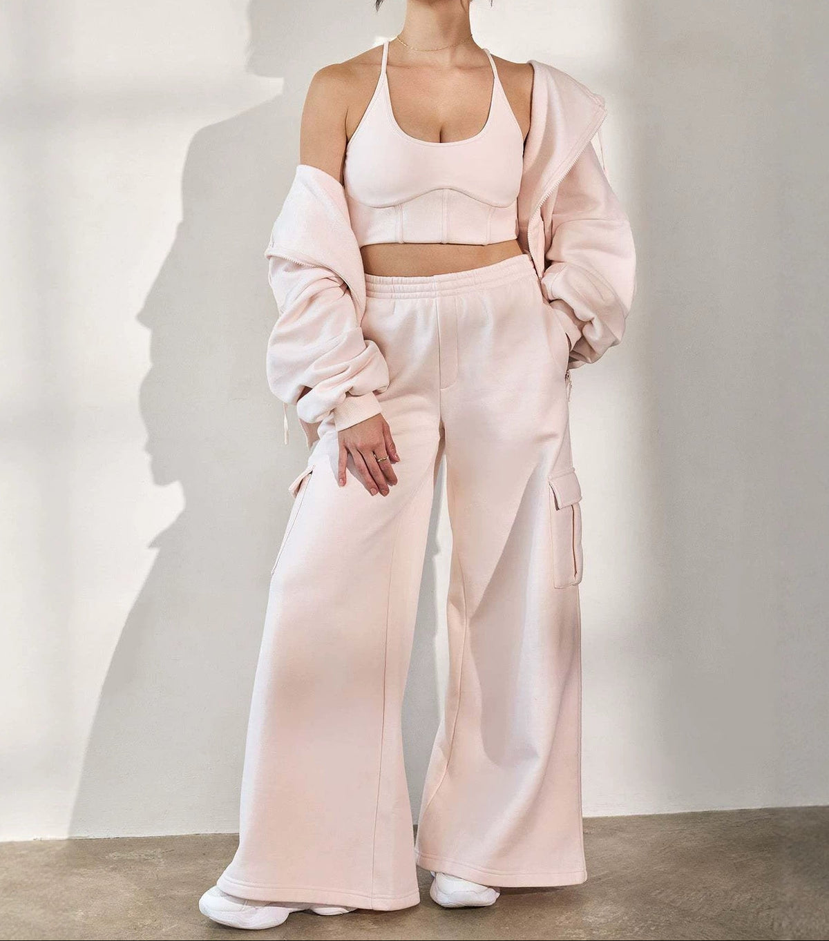 Light pink wide-leg cargo pants with drawstring waist and side cargo pockets