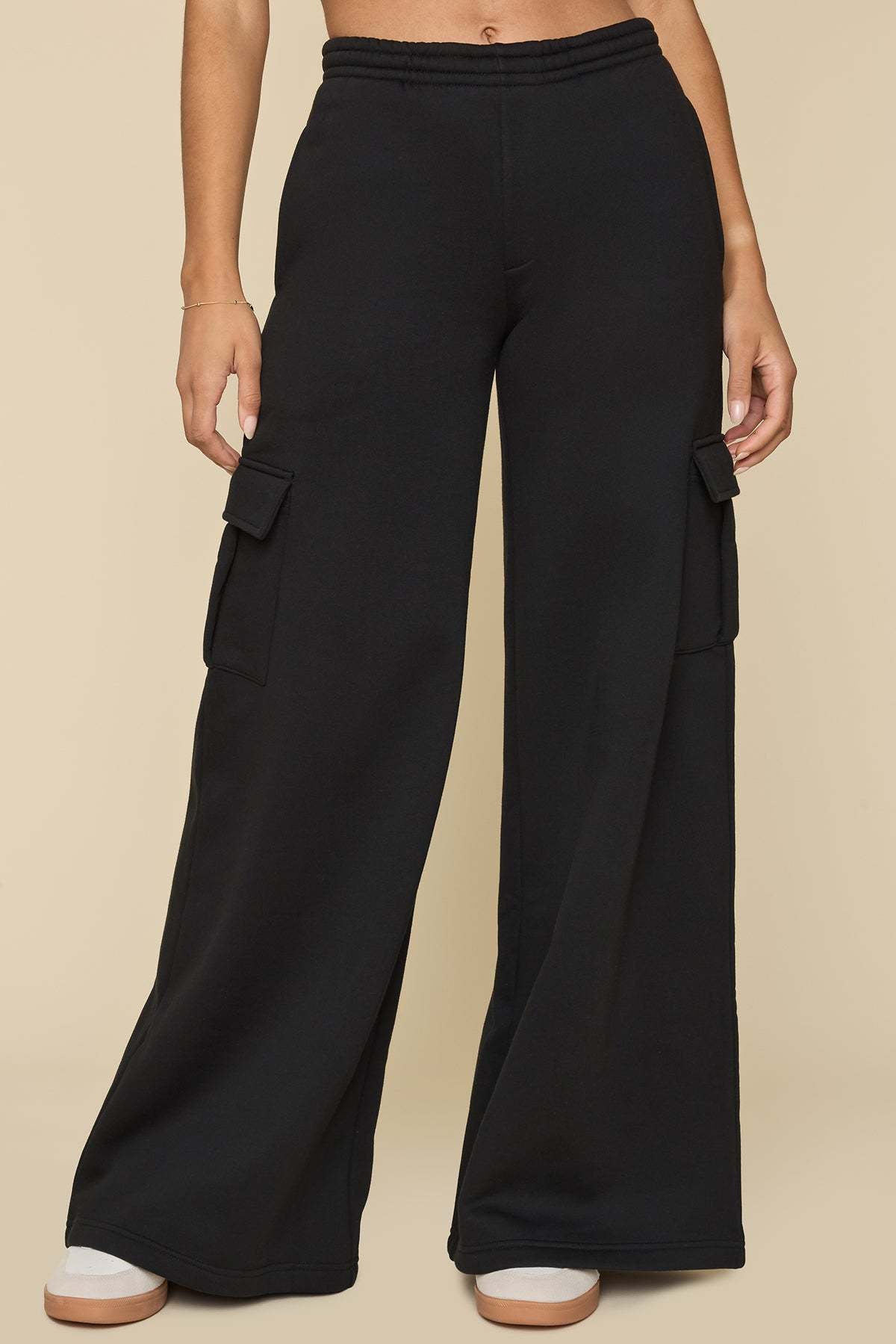 Black wide-leg cargo pants with drawstring waist and cargo pocket accents