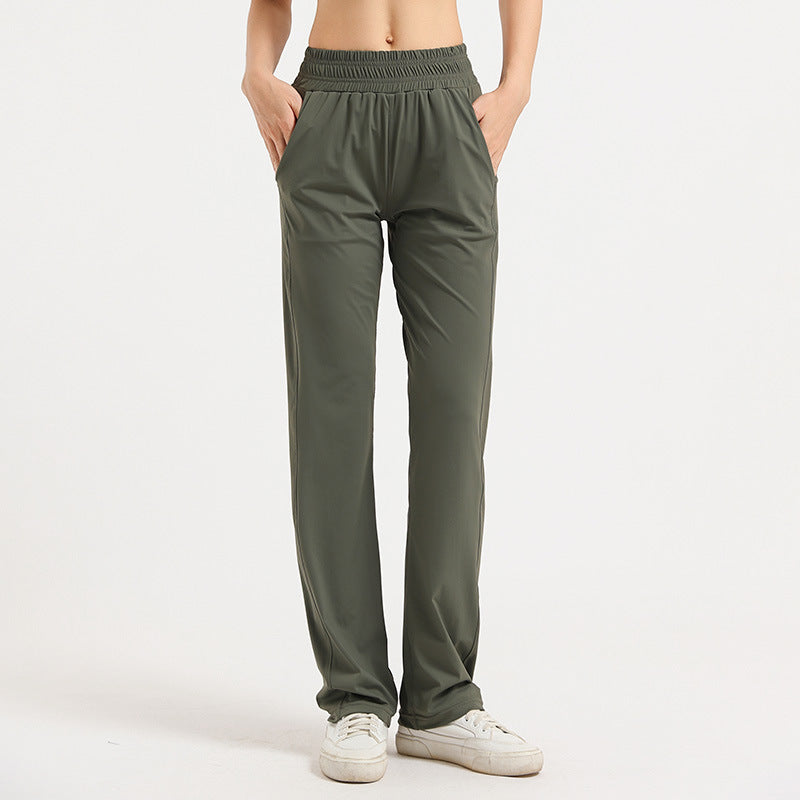 Women's loose sports trousers, deep olive green, elastic waistband, straight relaxed leg