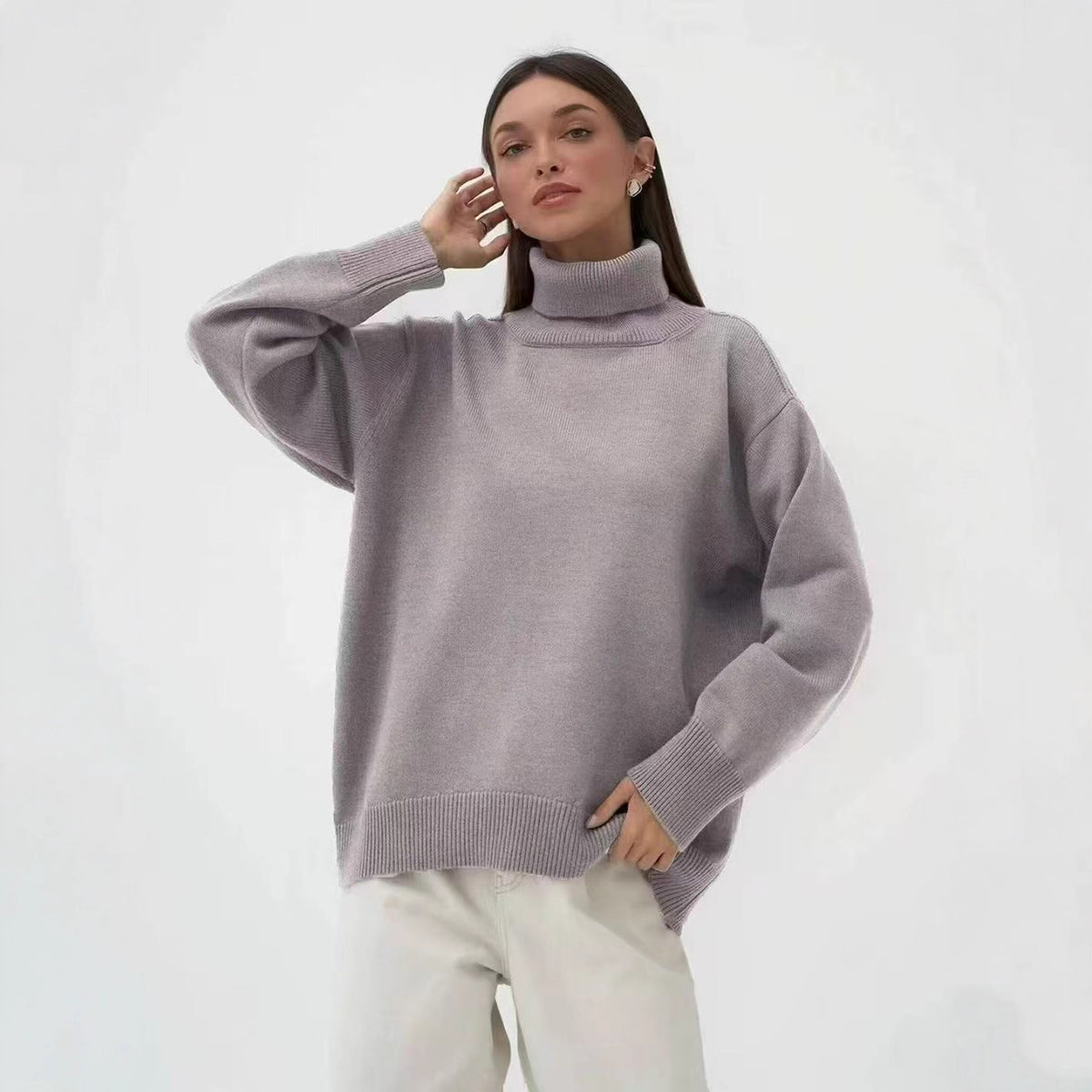Oversized gray turtleneck sweater with ribbed roll neck and dropped shoulders