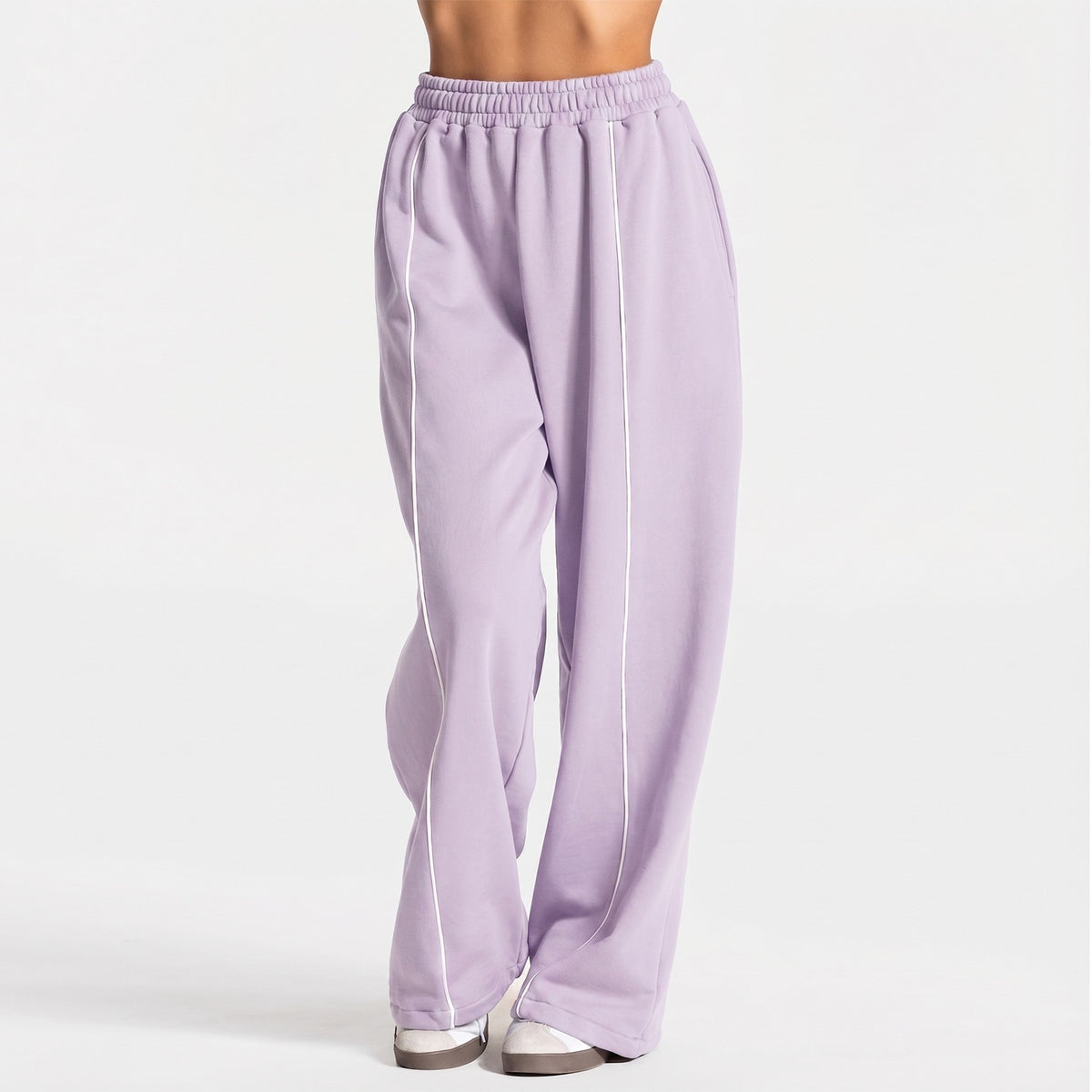 Light purple loose yoga pants with elastic waistband and vertical white contrast stripe
