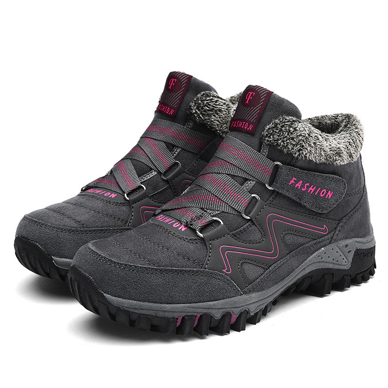 Charcoal winter snow boots with faux fur collar, pink accents, and deep traction tread