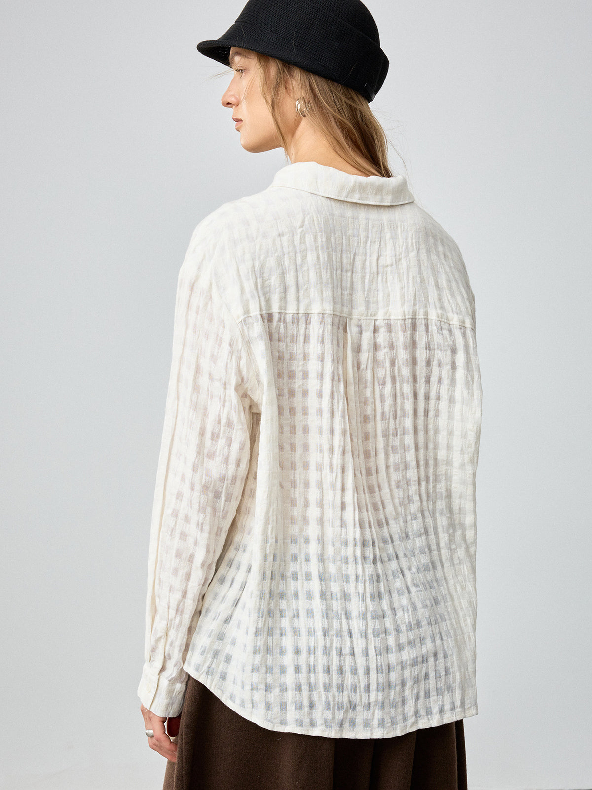 Off-white button-front shirt with collar, long sleeves, and vertical plaid texture (back view)