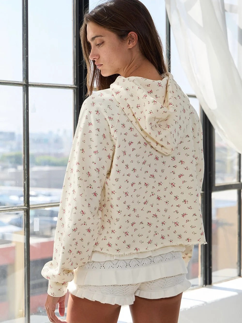Apricot floral print hoodie, long sleeves with ruffled cuffs and hooded neckline