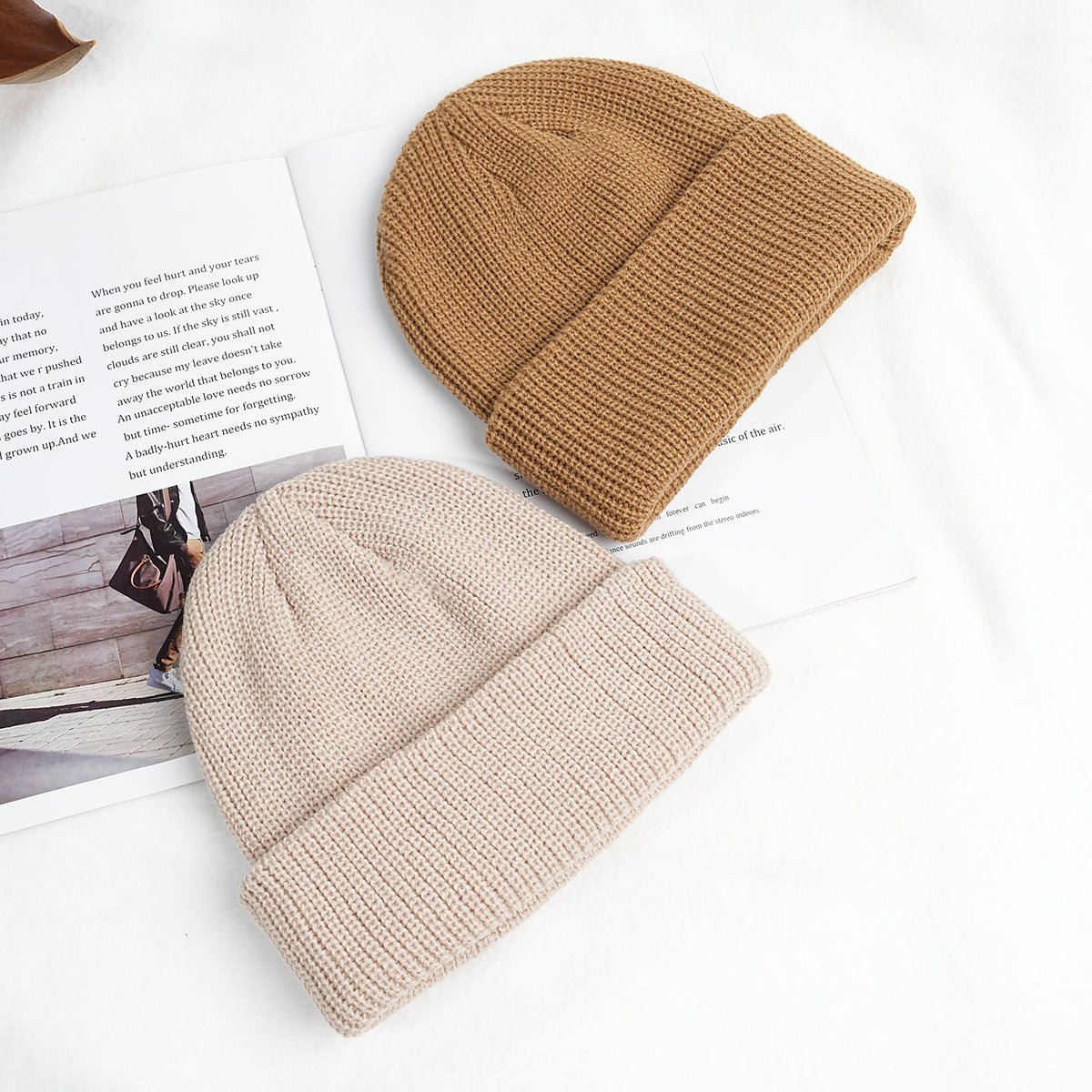 Thick knitted beanie hats in light khaki and beige, with ribbed cuff