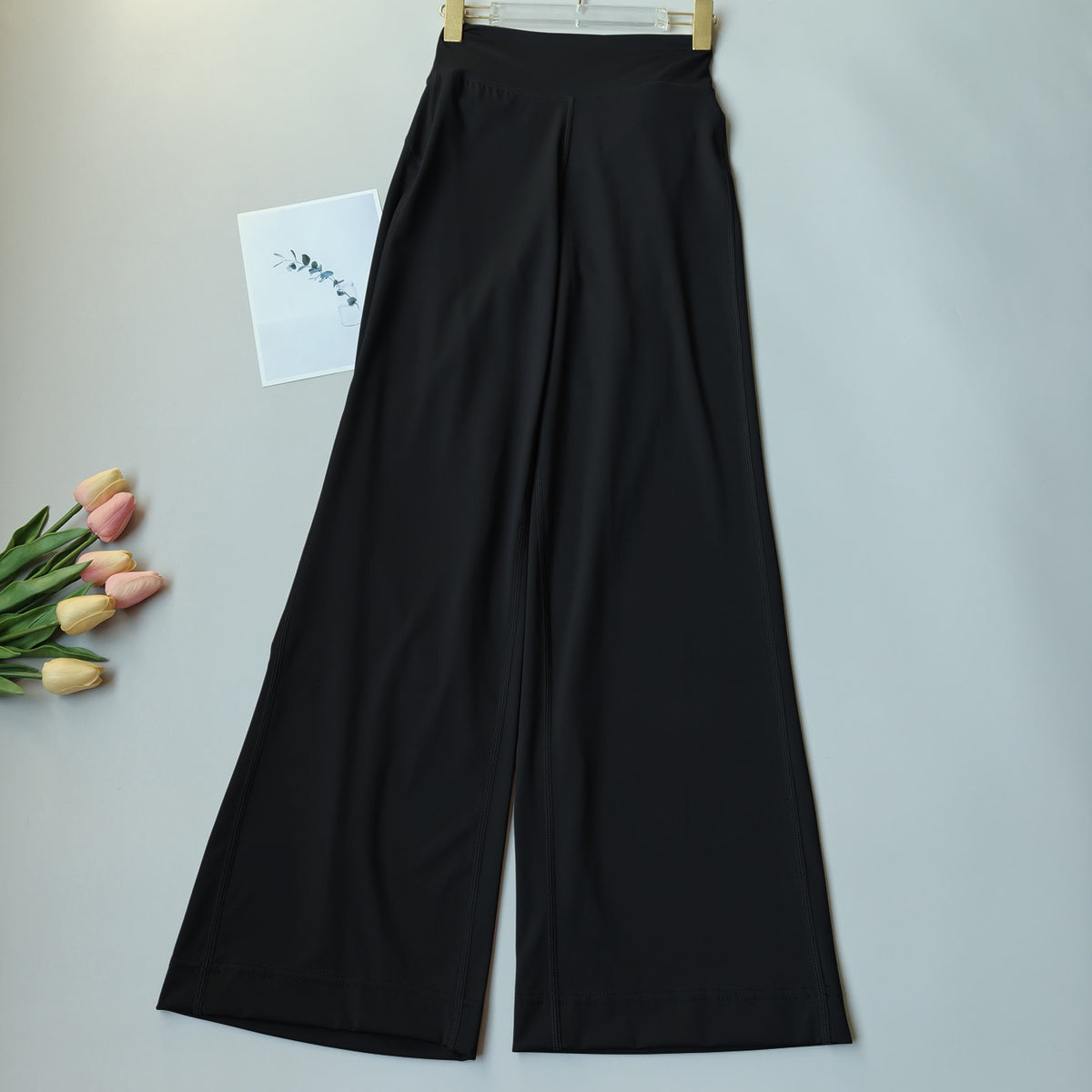 Black high-waisted wide-leg yoga pants, full-length relaxed drape
