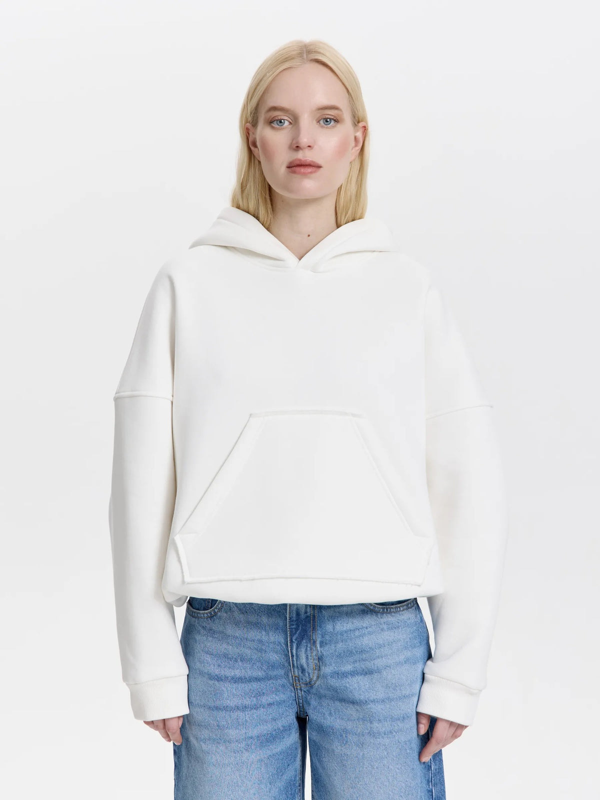 White oversized pullover hoodie with front kangaroo pocket and drawstring hood