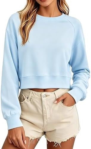 Light blue women's cropped sweatshirt with a round neck, long sleeves, and loose fit