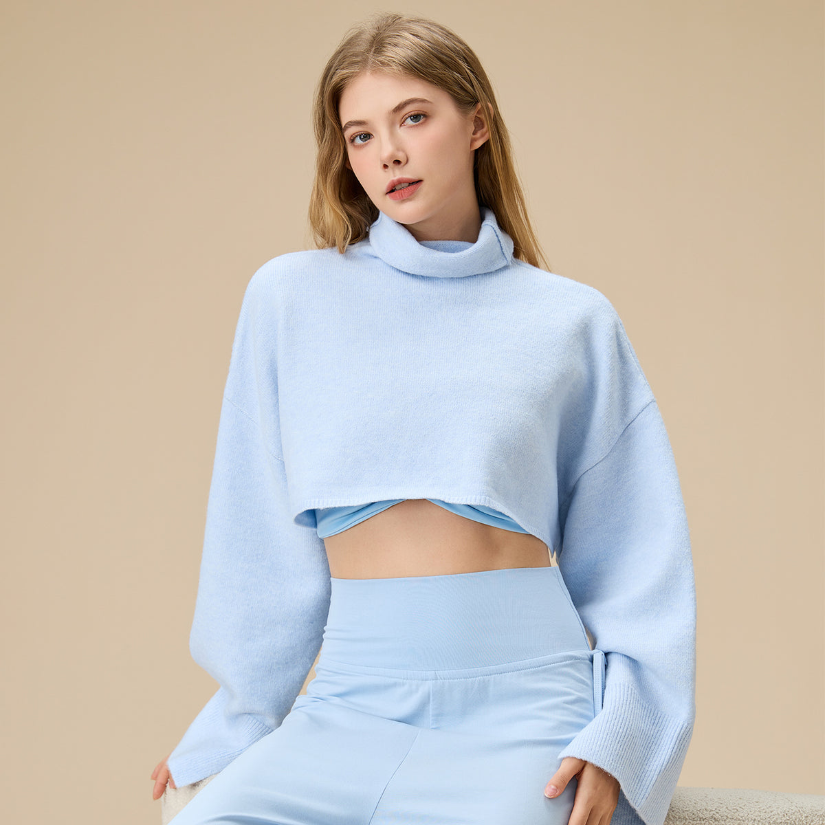 Light blue cropped turtleneck yoga blouse with long sleeves, relaxed fit