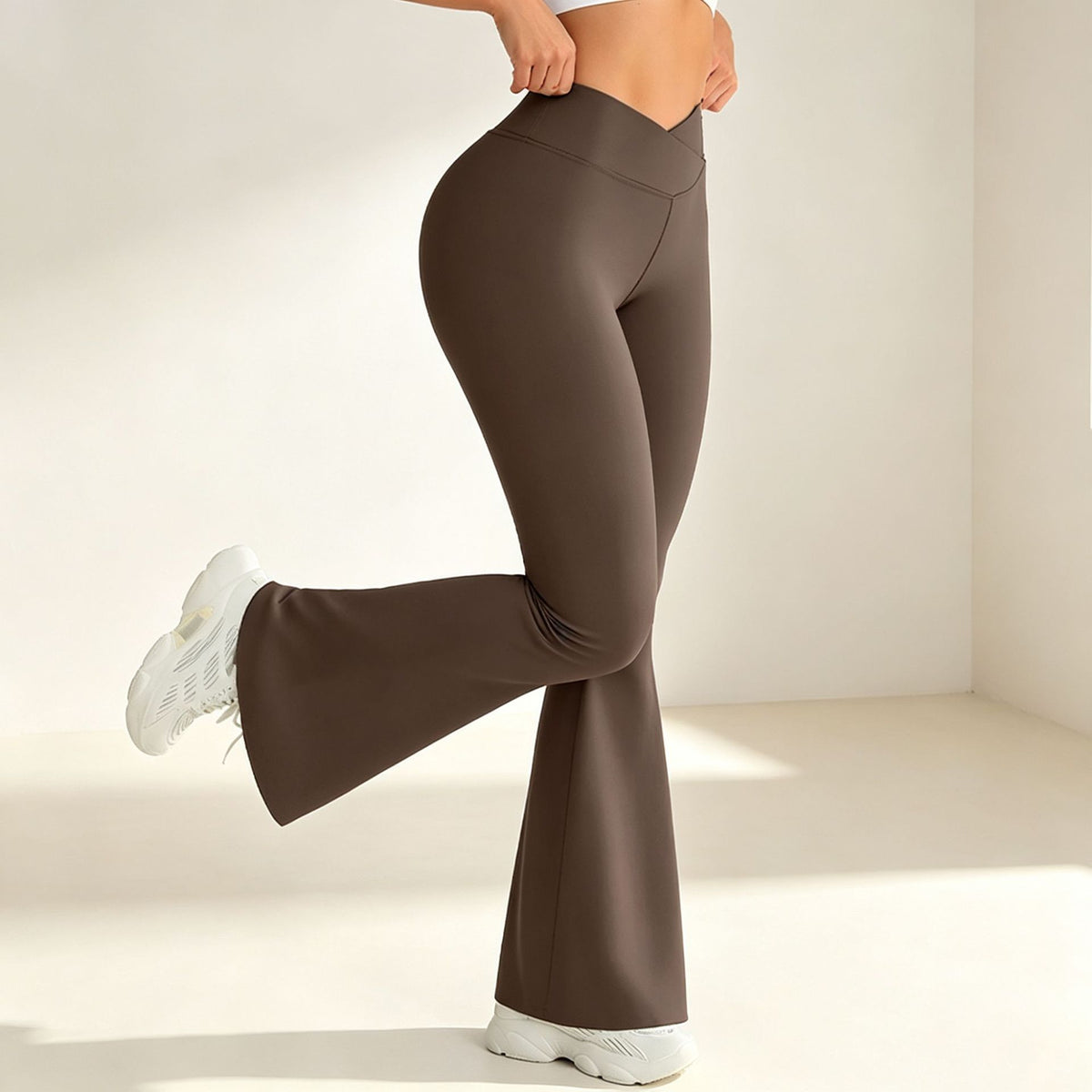 Brown high-waist flared yoga pants with sculpting seams and flared pant legs
