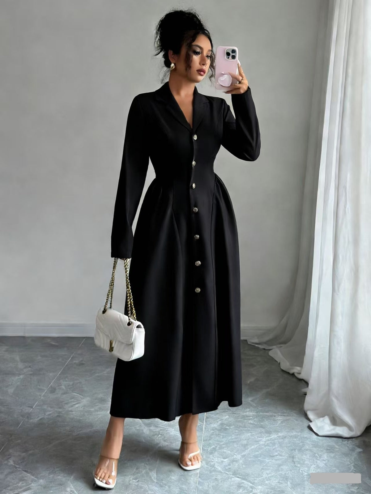 Black V-neck long-sleeve button-front dress with fitted waist, over-the-knee length