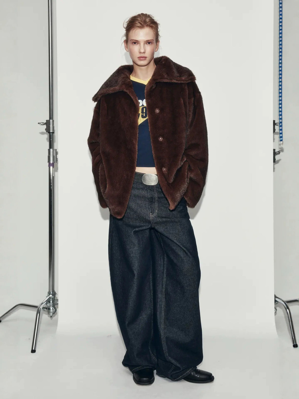 Wine-brown faux fur coat with wide collar, flap pockets, button front
