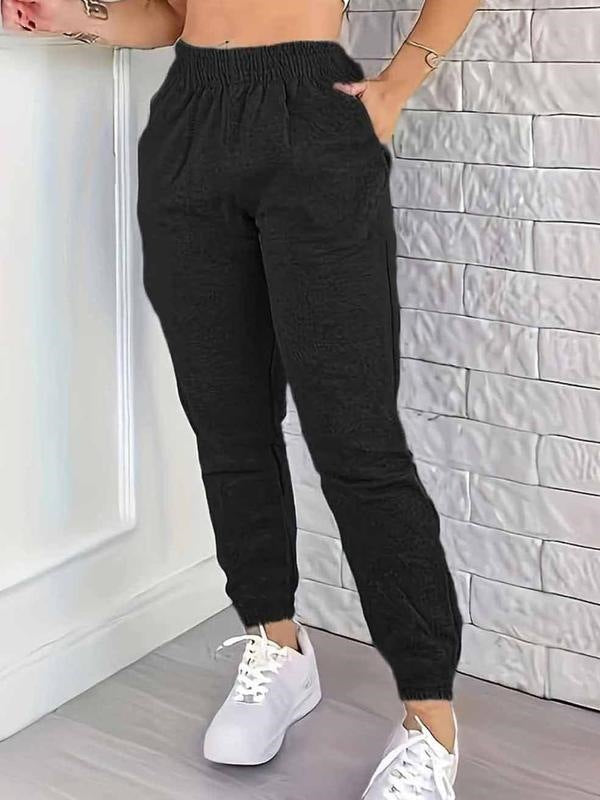 Black women's jogger pants with elastic waistband and tapered ankle cuffs