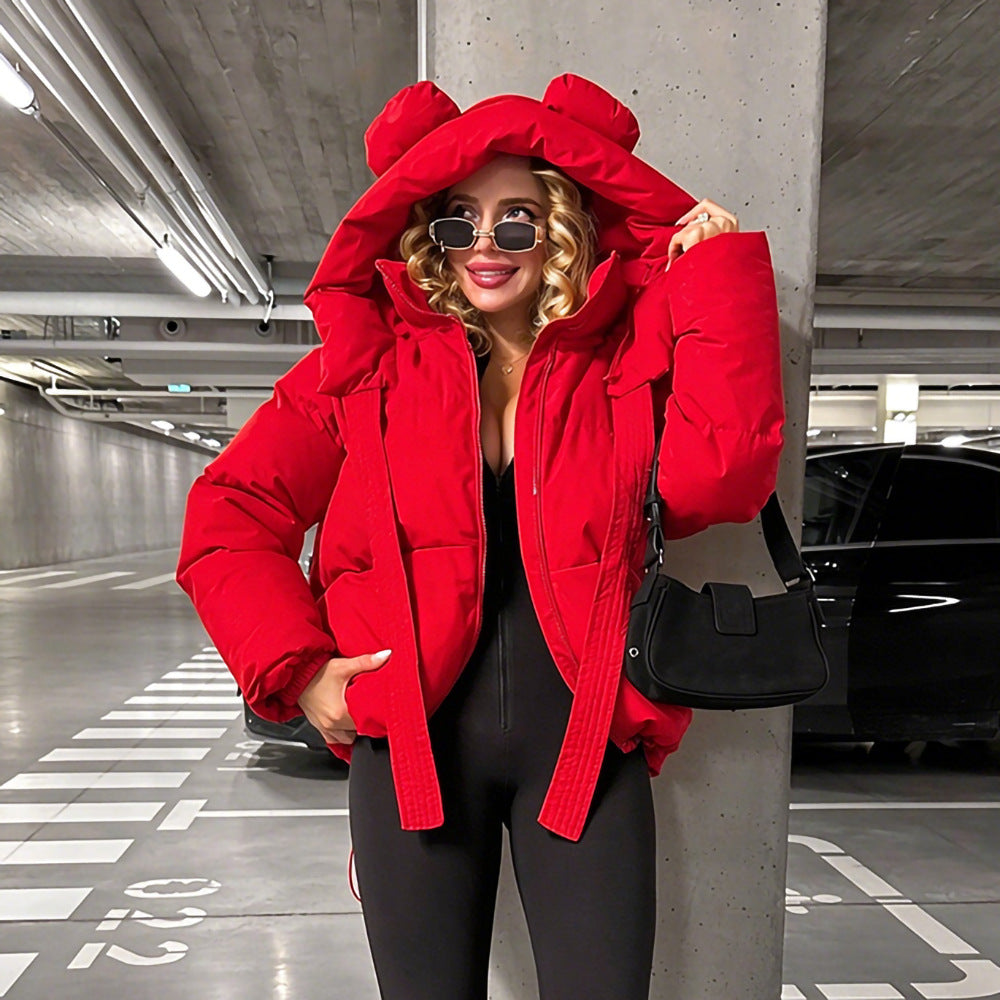 Red padded jacket with oversized hood, rounded ear details, and long drawstrings.