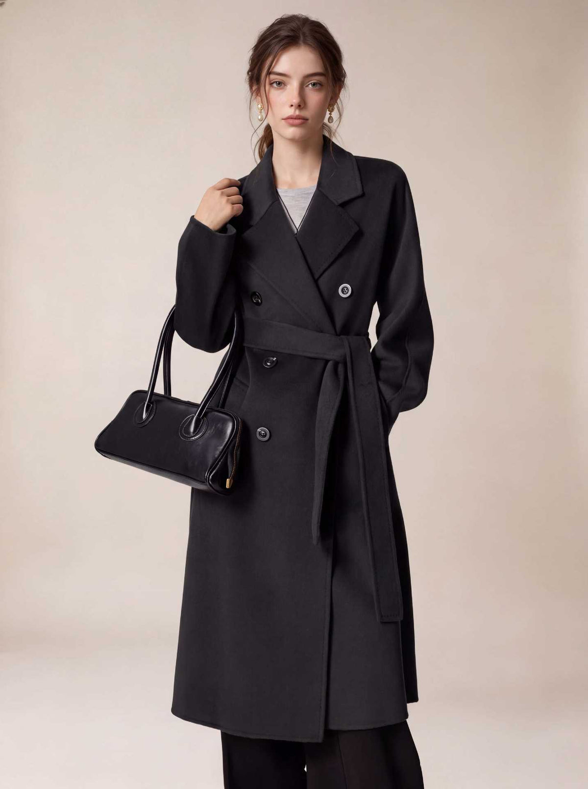 Long black belted double-breasted wool coat with wide lapels