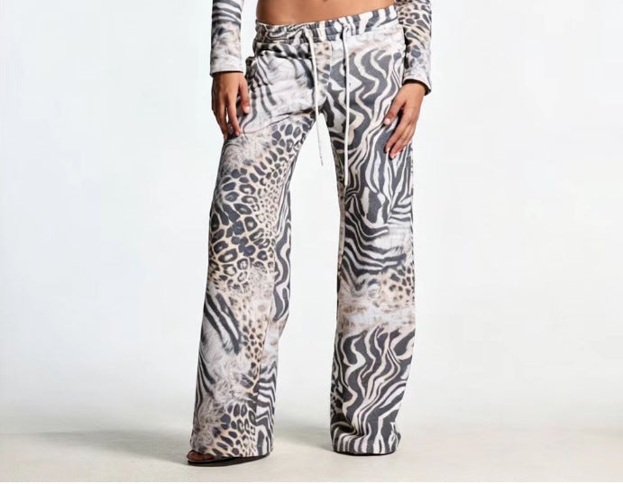Animal-print wide-leg pants with zebra and leopard patterns, elastic waistband