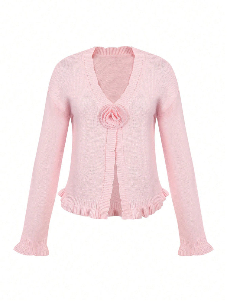 Pink V-neck knitted cardigan with flower rosette and ruffled hem