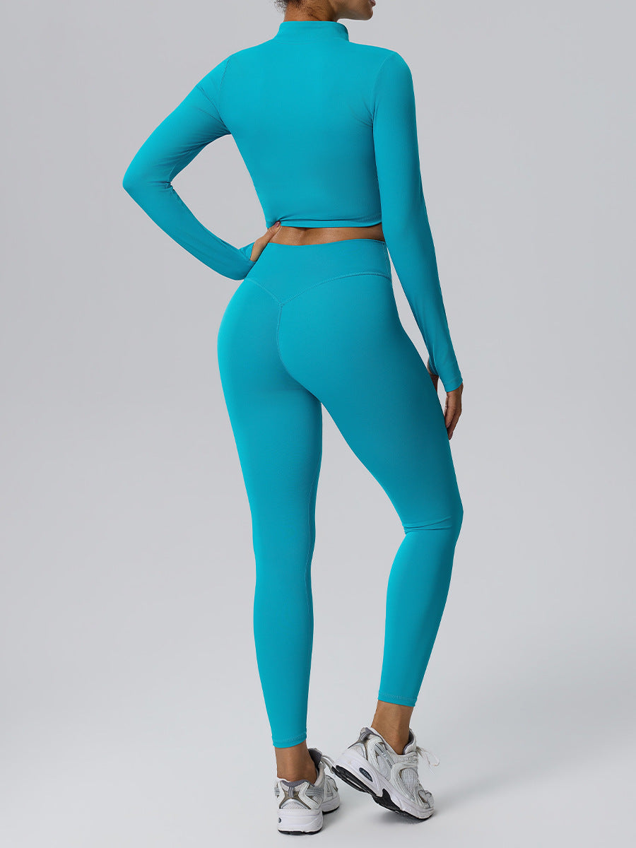 Women's blue-green yoga set, back view: zip long-sleeve crop top and leggings