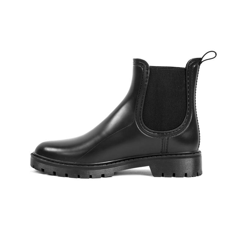 Black short Chelsea rain boots with rounded toe, elastic gore, and lugged sole