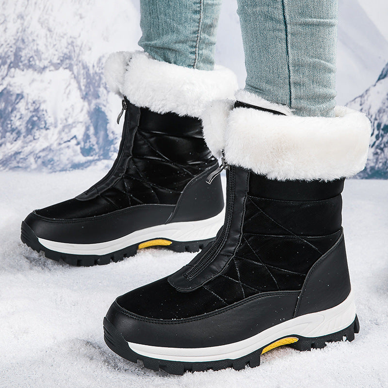 Women's black mid-calf snow boots, glossy quilted upper, faux-fur trim, side zip.