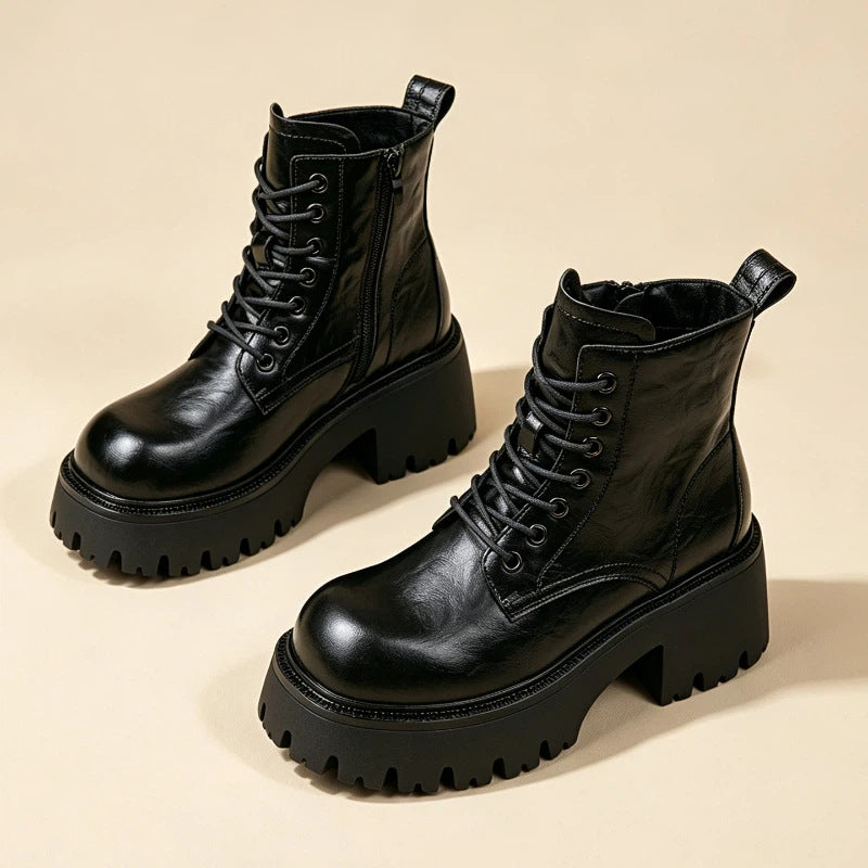 Black lace-up combat ankle boots with chunky platform and lug sole