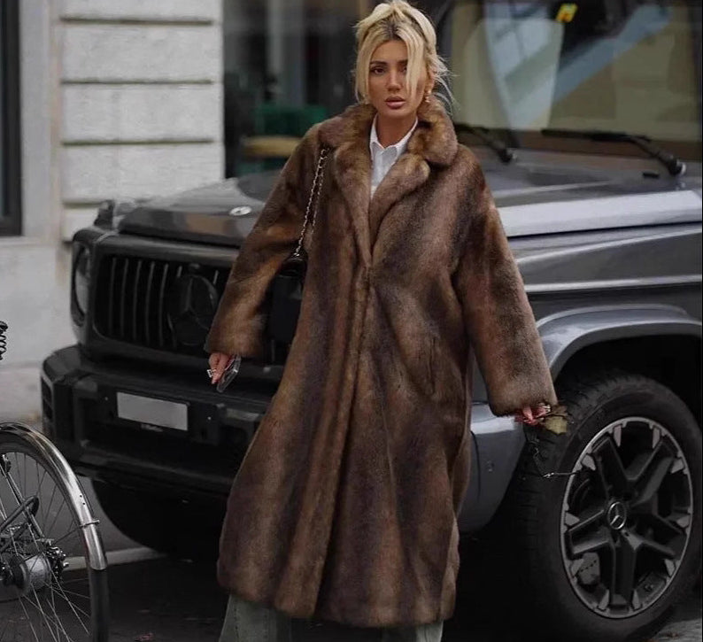 Women's brown faux fur maxi coat with wide lapel and longline silhouette