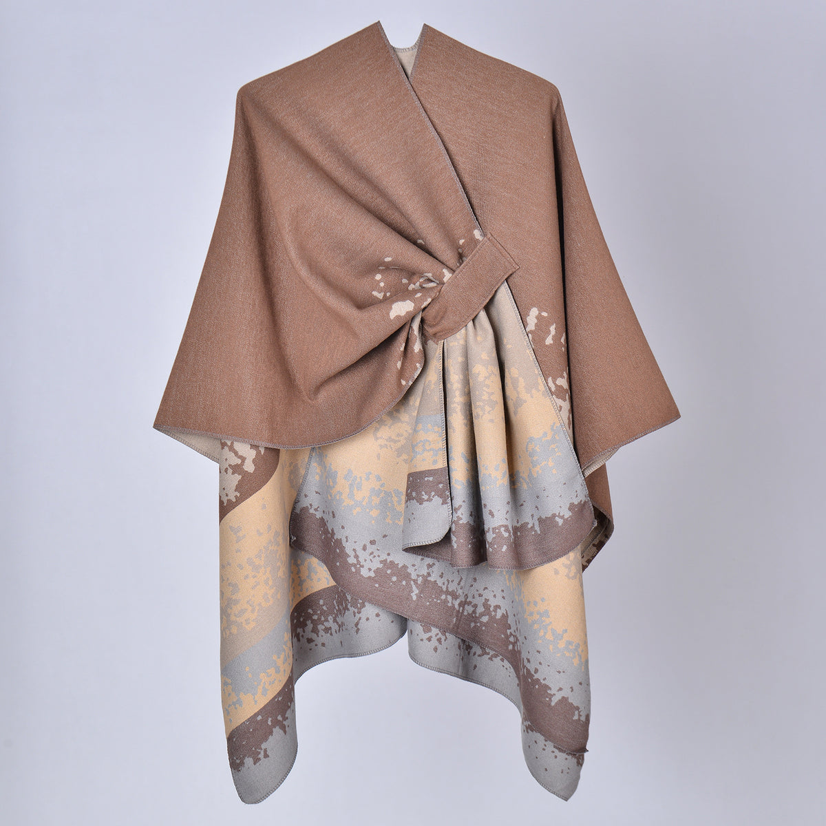Faux cashmere print shawl, taupe top with light beige and blue splash pattern, draped.