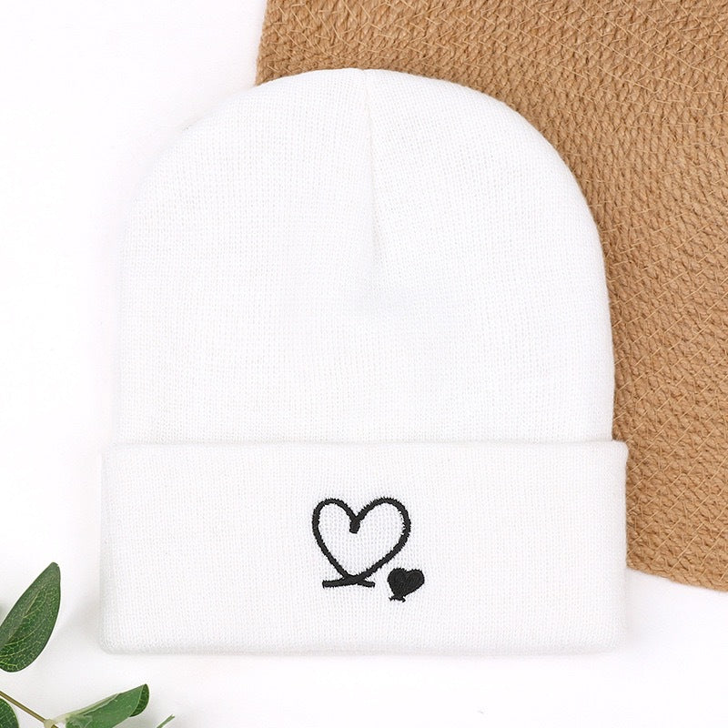 White knit beanie with heart and small heart embroidery on cuff