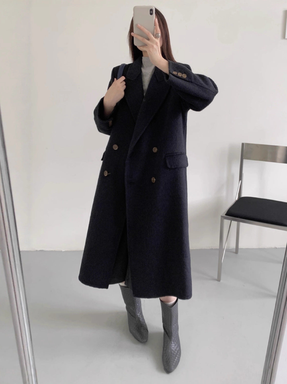 Dark navy long double-breasted cashmere coat with high collar and gold-tone button placket