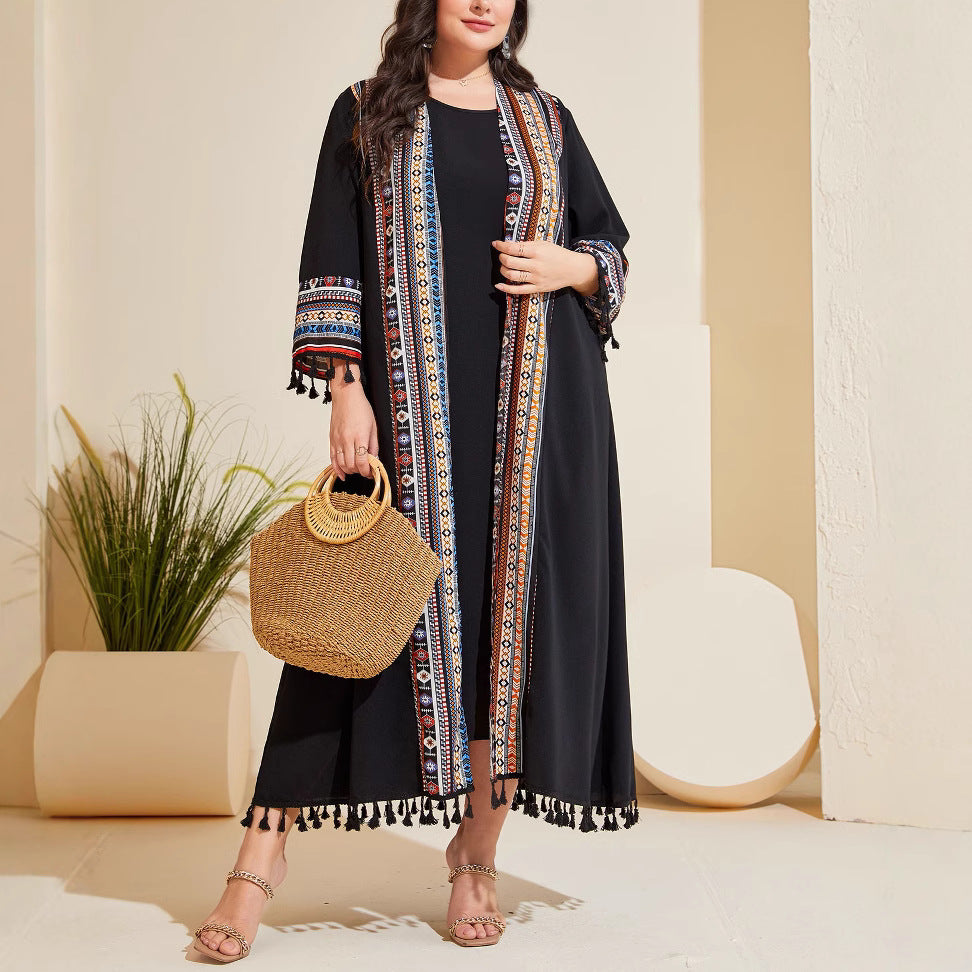 Black long cardigan with vertical embroidered trim and tassel hem, wide sleeves
