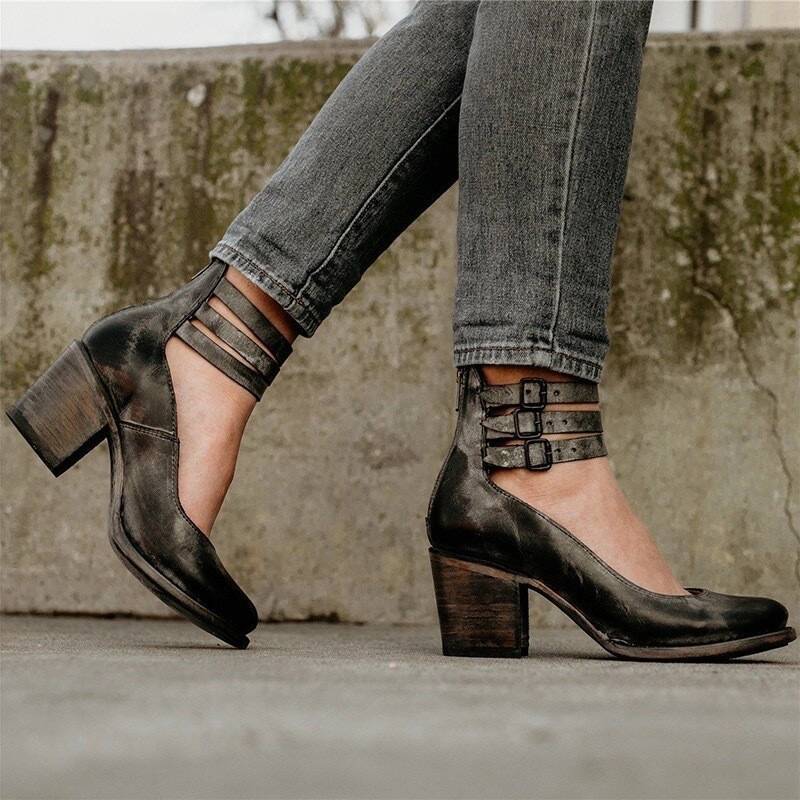 Black ankle boots with chunky heel and buckle strap detail