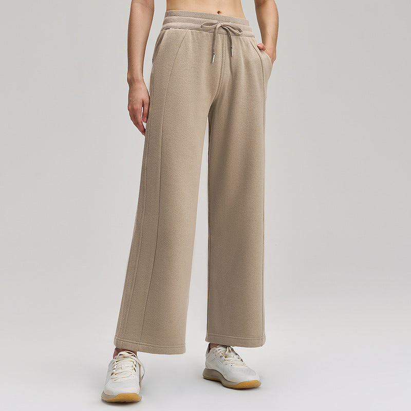 Fleece-lined wide-leg pants in light beige, mid-waist drawstring, loose straight legs