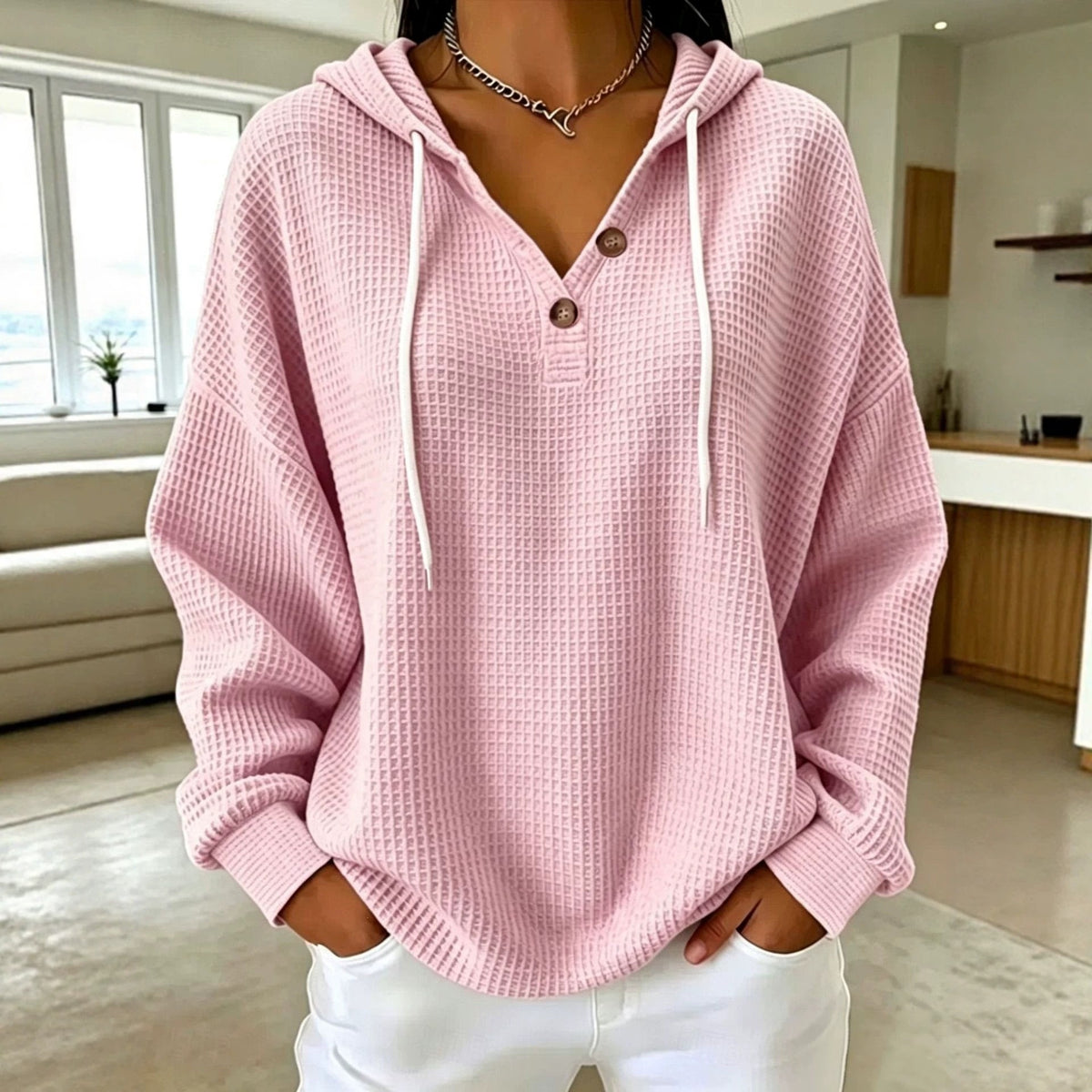 Women\u2019s waffle-knit drawstring hoodie with henley button placket, pink hood and long sleeves