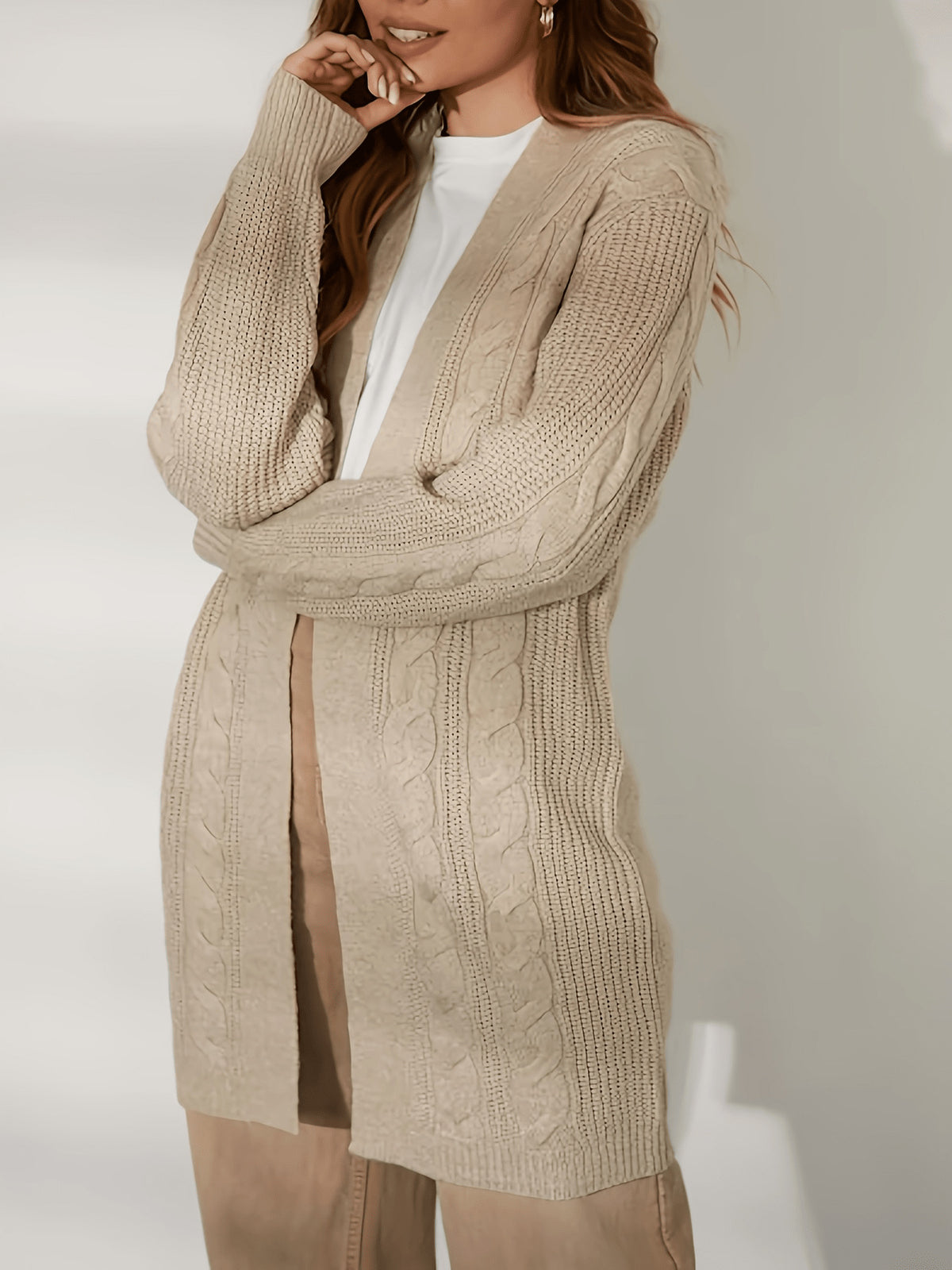 Khaki long cardigan with open front and chunky cable-knit texture on sleeves