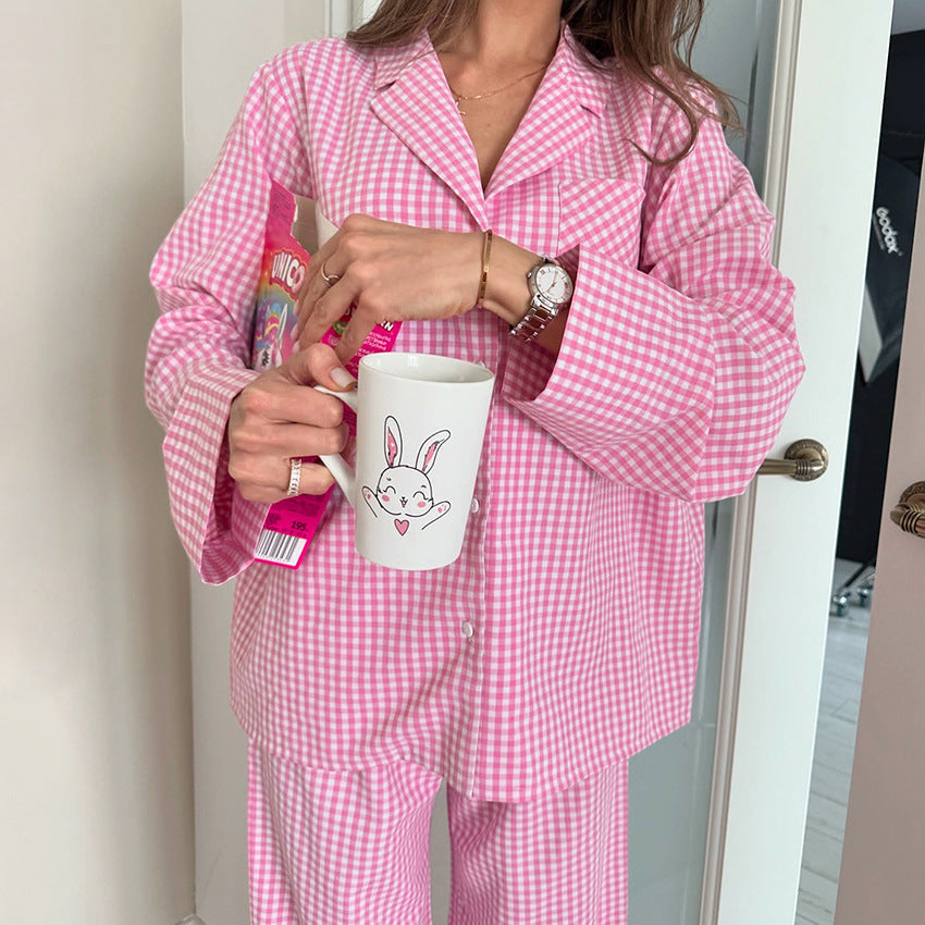 Pink gingham pajama set detail with notched collar, buttons, and long sleeves