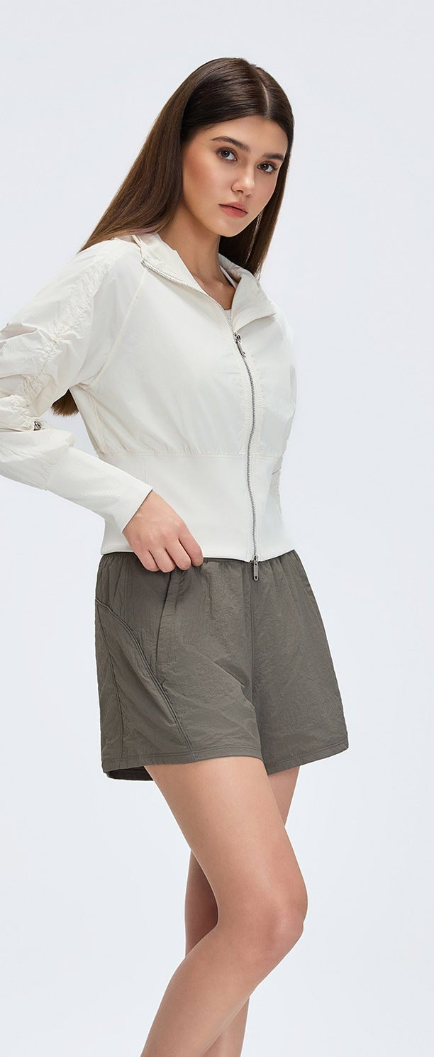 White cropped zip-up windbreaker with hooded collar and long sleeves