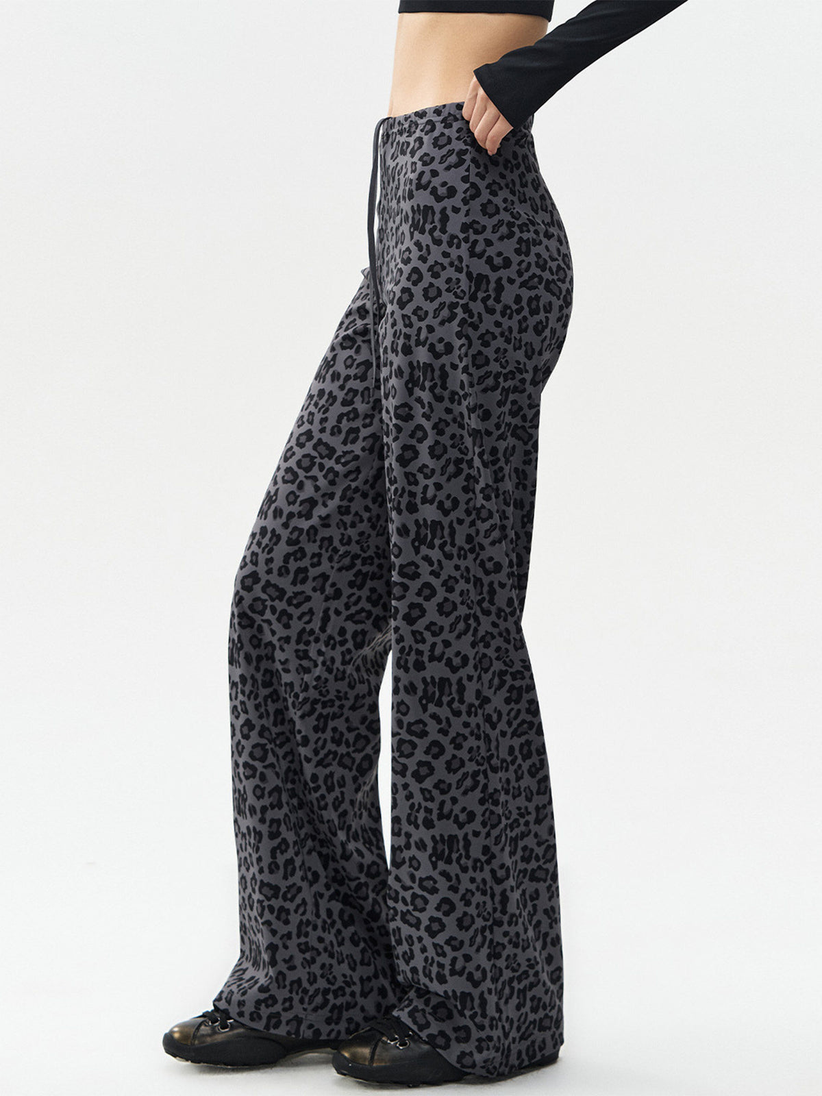 Gray leopard-print wide-leg pants with black spots, high-rise elastic waistband and drawstring.