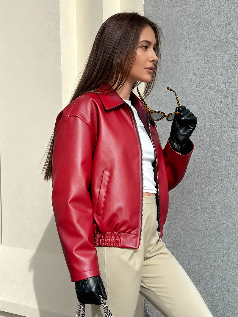 Women’s red faux leather jacket with pointed collar and front zip, oversized sleeve fit