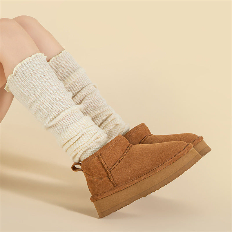 Brown suede slip-on snow boots with fleece lining and thick rubber sole