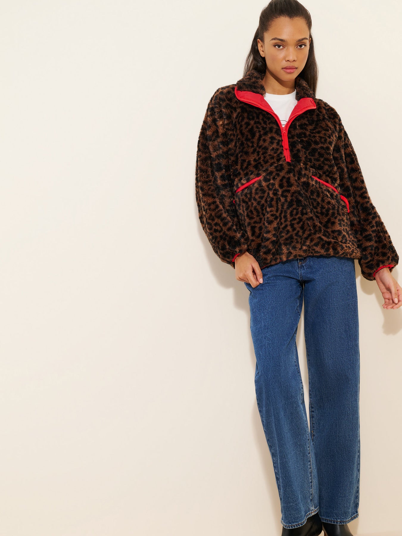 Brown leopard teddy fleece jacket with red quarter-zip and contrast trim