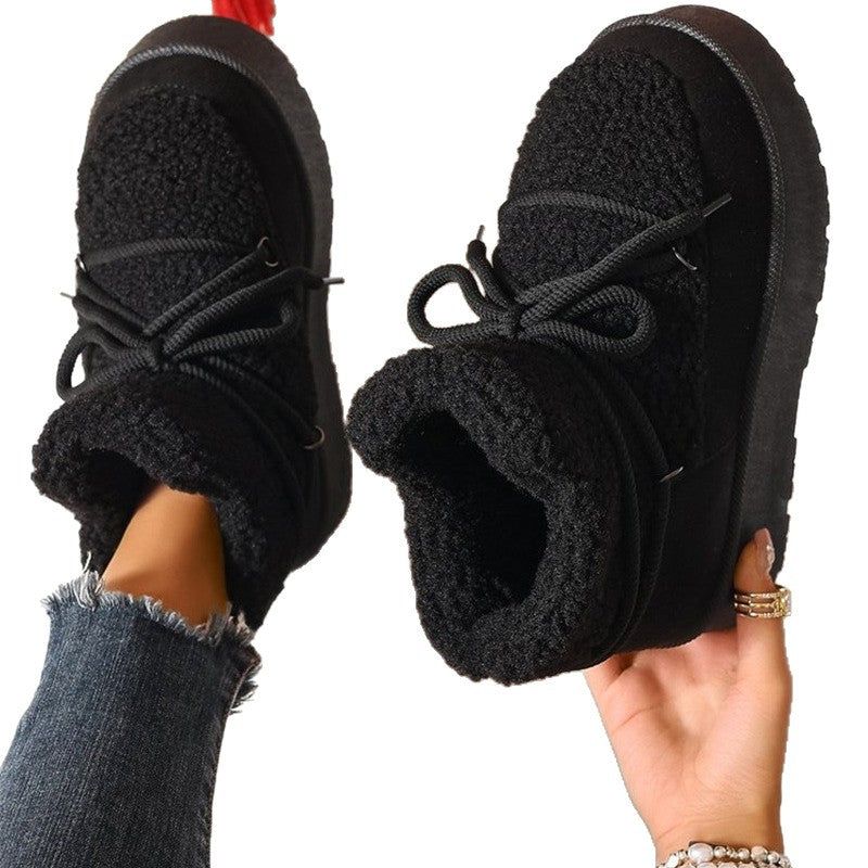Black lace-up snow boots with plush sherpa lining and round platform sole