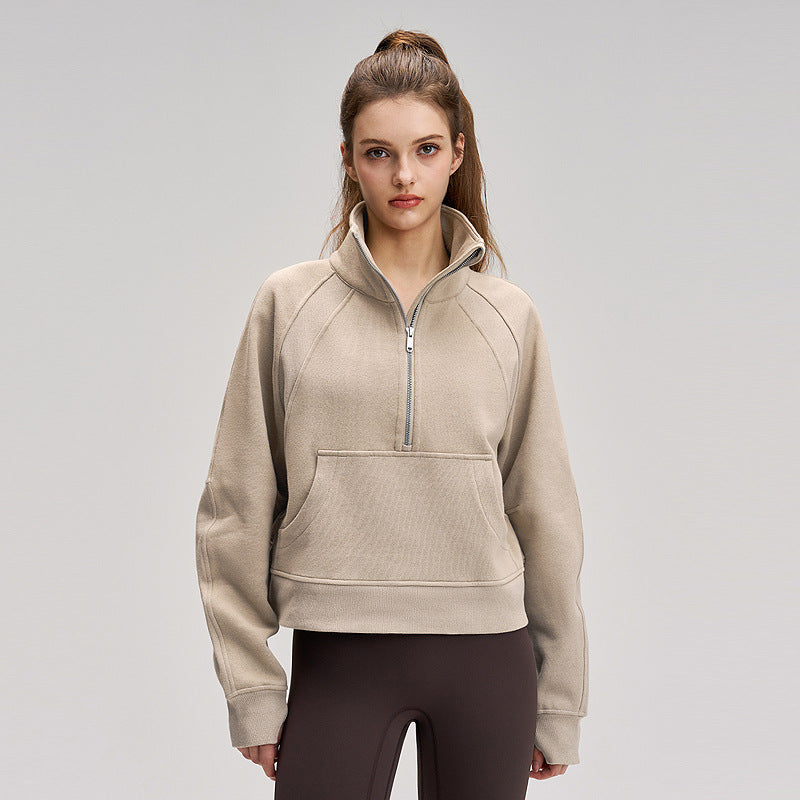 Beige fleece-lined sports sweatshirt with high neck, half zip and kangaroo pocket
