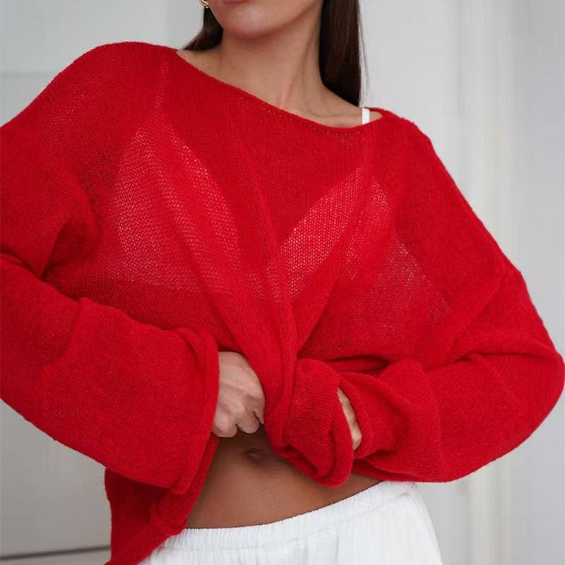 Red women’s sheer knit sweater top with round neckline and oversized long sleeves