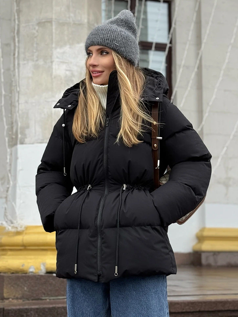 Black hooded puffer jacket with adjustable waist drawstring and zipper closure