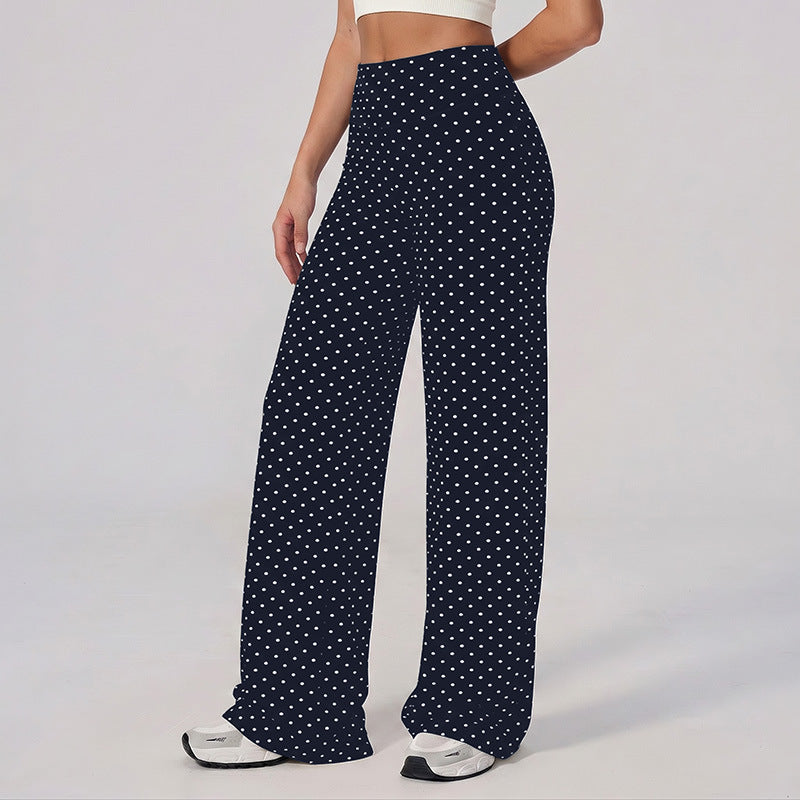 Wide-leg pants in dark navy with white polka dots, high-rise waistband