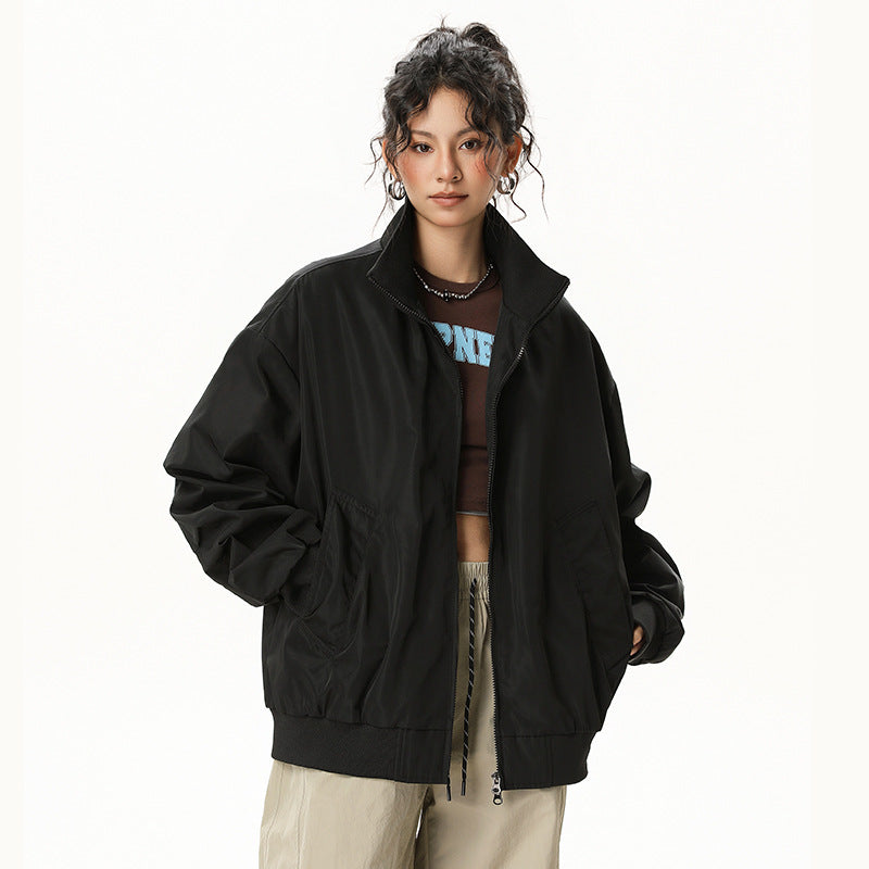 Black bomber jacket with zip front and stand collar; ribbed cuffs and hem.