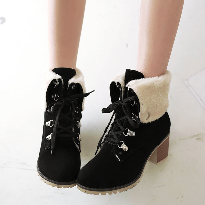 Women’s lace-up short boots with faux-fur cuffs, chunky heel, black with white trim.