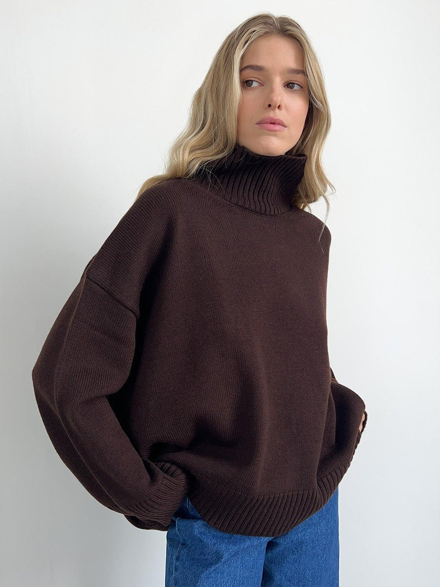 Loose turtleneck knit sweater in dark brown, ribbed collar and hem, relaxed fit.