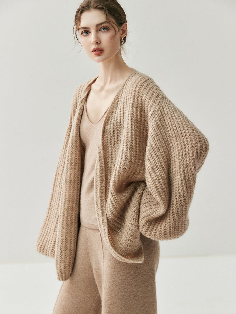 Beige loose knitted cardigan with draped shoulders and open front