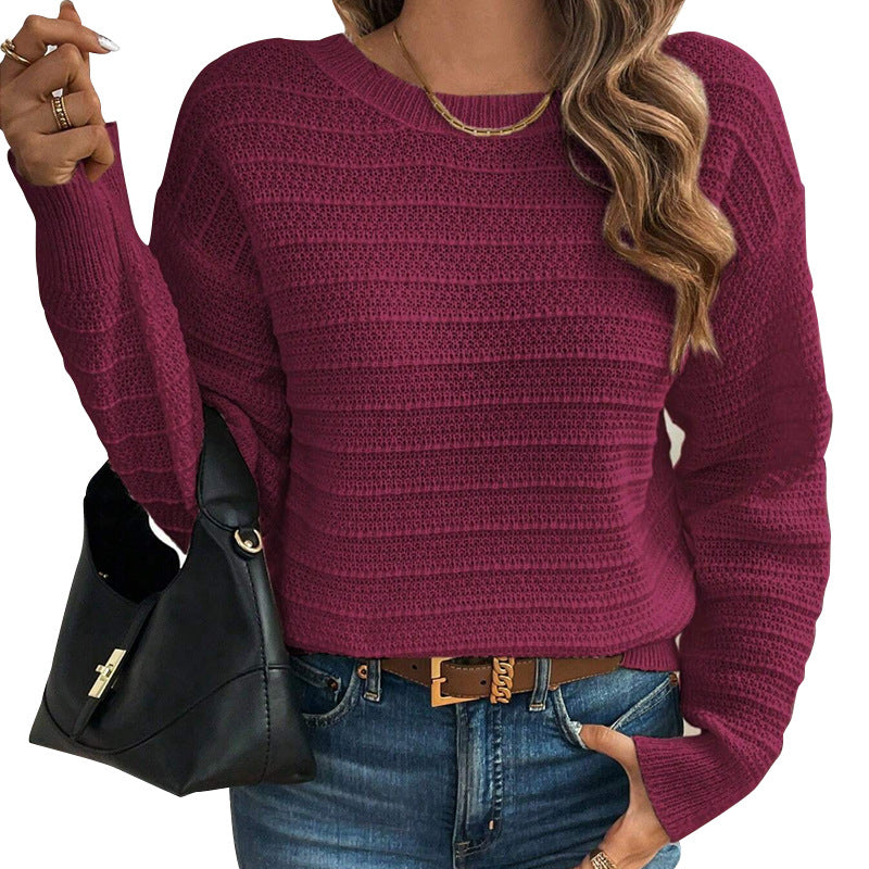 Burgundy knit sweater with crew neck and long sleeves